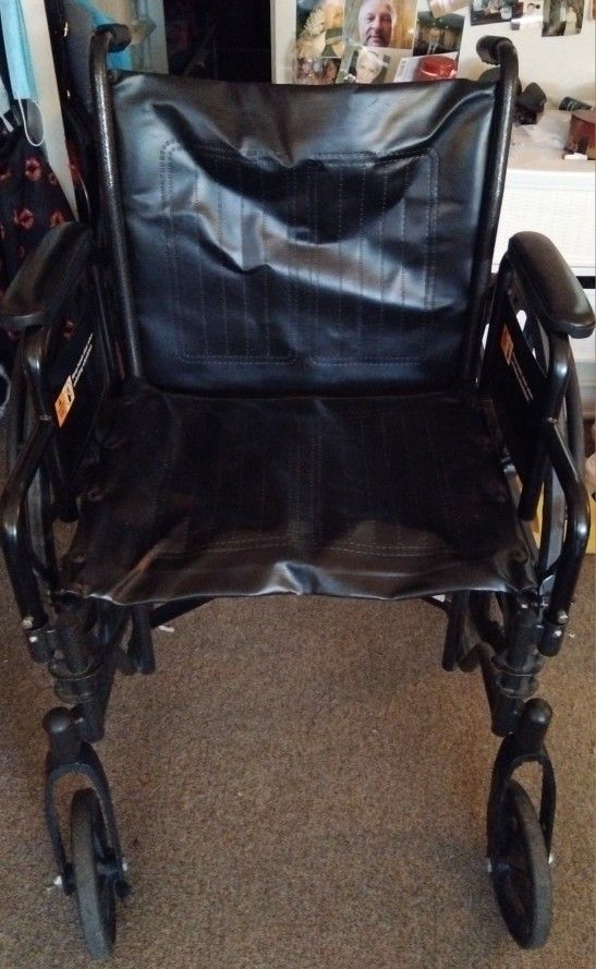 Large Wheelchair With Foot. Pedals.
