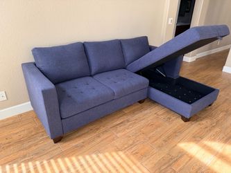 Blue sectional sofa with chaise and storage