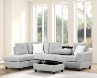 New light gray sectional with storage ottoman and free delivery