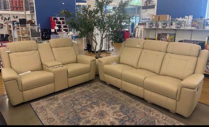 Beige leather fully reclining couch and love seat