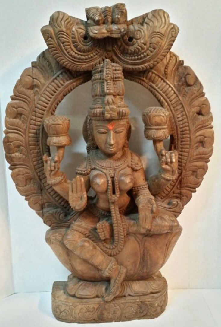 Vintage wooden carving of Hindu goddess Lakshmi from India