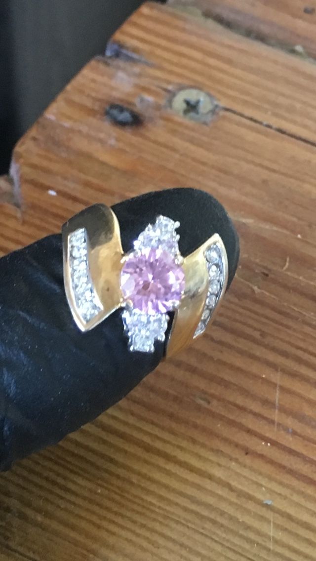 Beautiful Pink center Stone Surrounded by little Diamonds