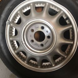 Tire Goodyear Conquest on rim with air in it
