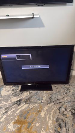 Samsung tv and 2 Dell desktop monitors