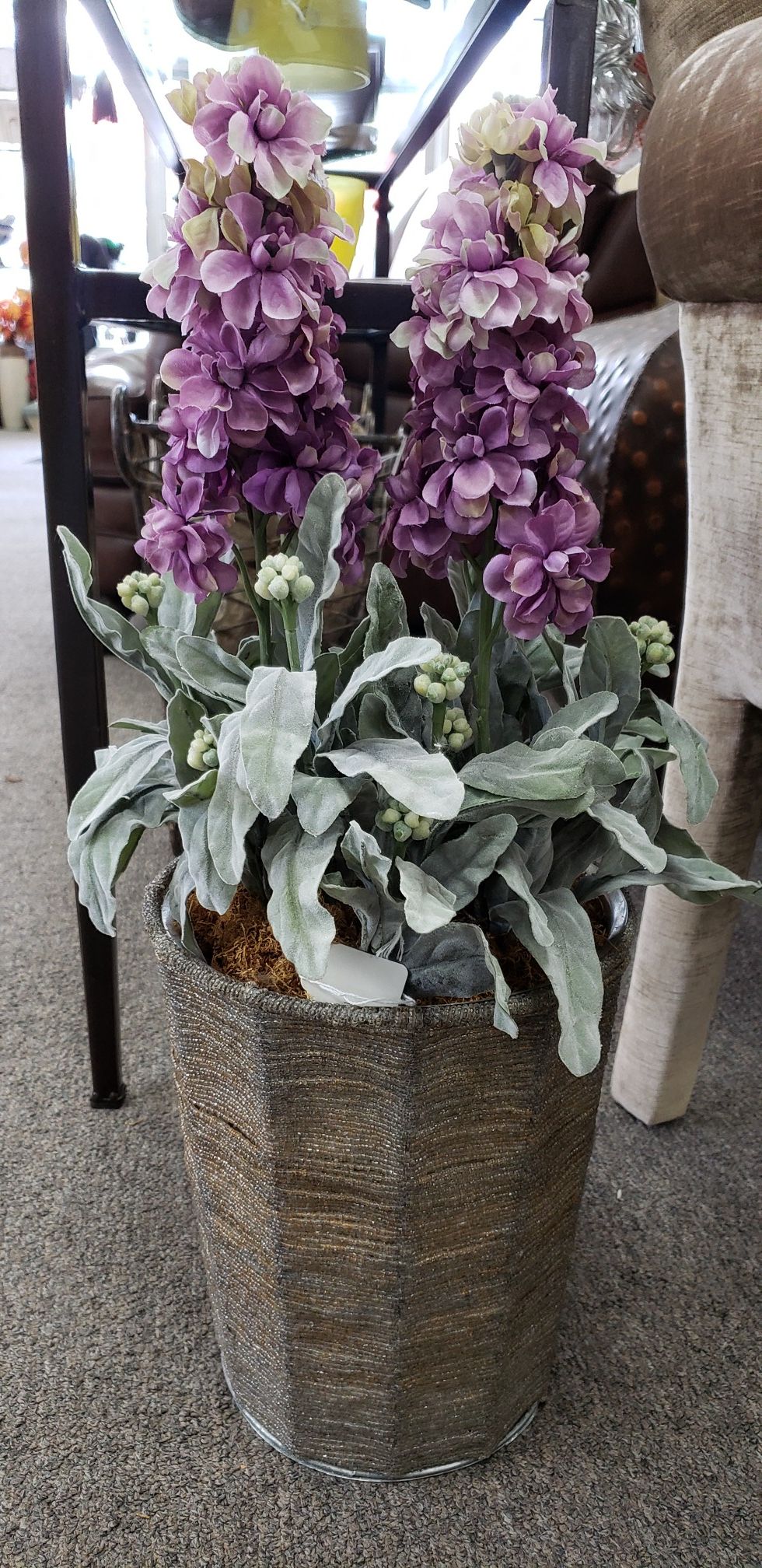 Purple flower in beaded metal vase