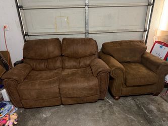 Brown reclining loveseat and matching armchair