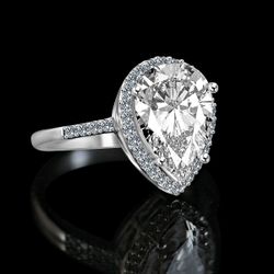 4 ct.Classic pear center w/halo settings ring, simulated diamond -diamond veneer® set in 14K gold. 635R71421k