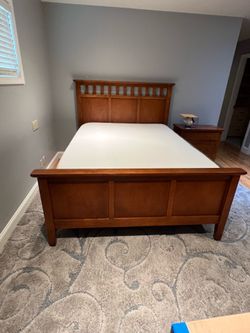 Queen sized wooden bed frame