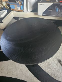Round black coffee table