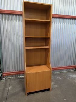 Functional Light Wood Bookcase with Integrated Cabinet