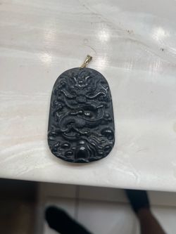 Black obsidian carved dragon pendant