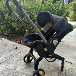 Doona Stroller With Base With new seat protector
