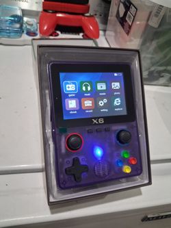 X6 Handheld retro video game console in transparent purple.  New.   fully laminated IPS OCA screen.  Features a dual 3D rocker design 4- core 32 bit p
