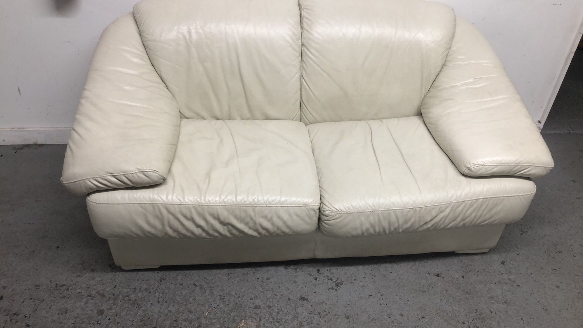 Real leather beige color love seat sofa very good condition