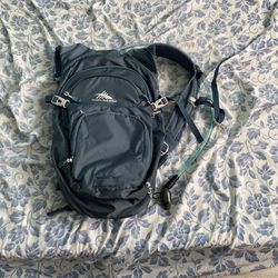 Light Blue High Sierra hiking backpack with water pouch