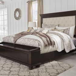 Brynhurst Dark Brown King Upholstered Storage Bed

