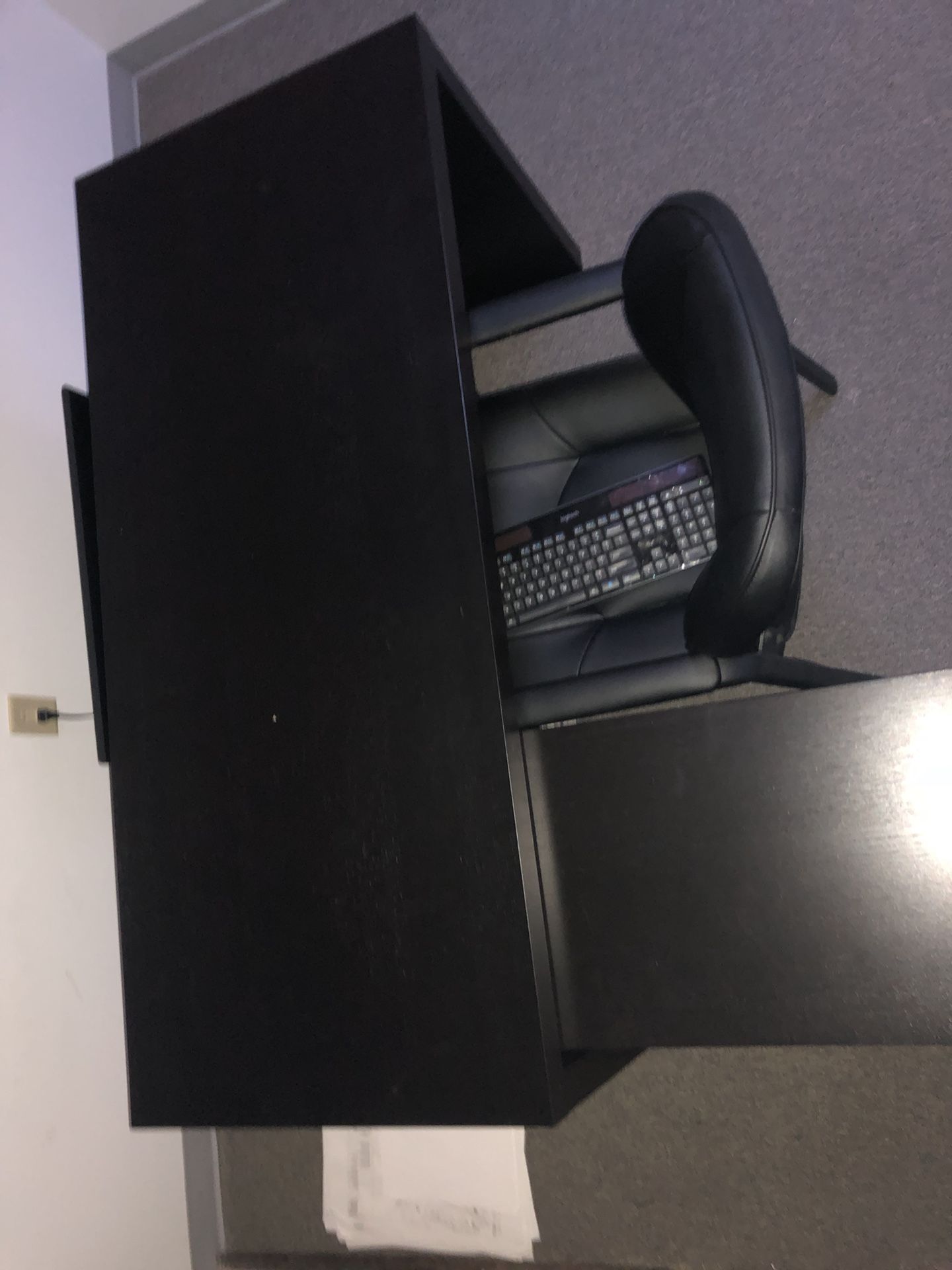 Black office desk with office chair.