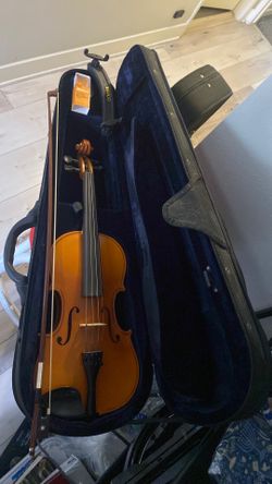 Violin said, with bow in shoulder support