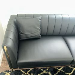 Black faux leather couch