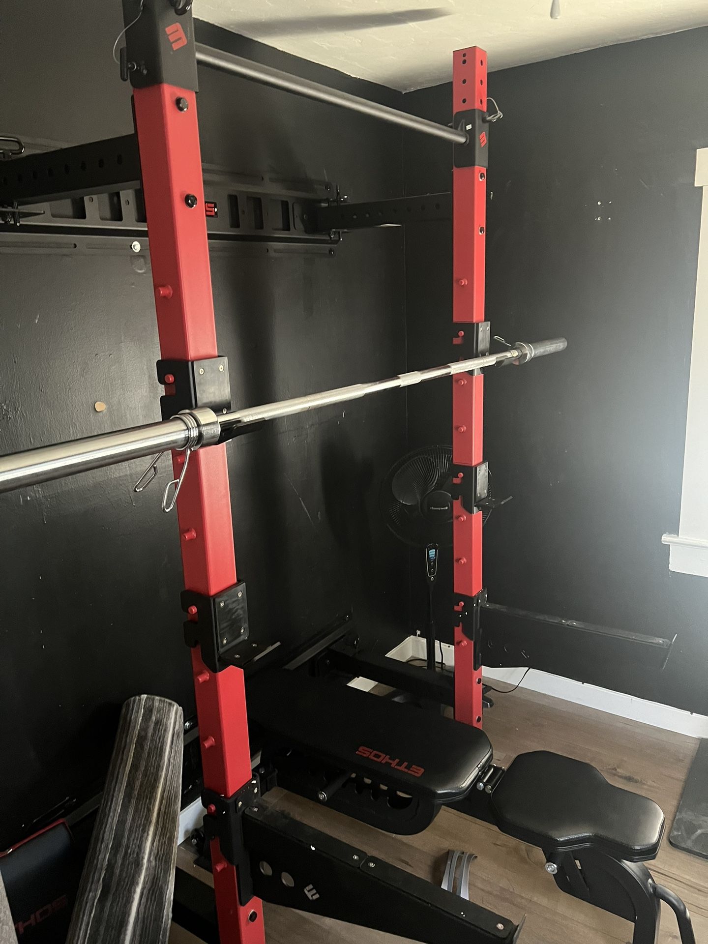 Ethos Fold Down Wall Mounted Cage, Weights, And A Bench.
