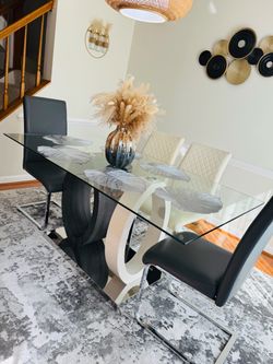 Dining table with 6 chairs and one area rug