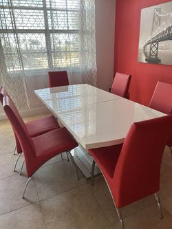 White table with 6 red chairs