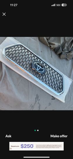 2016-2020 Toyota Tacoma front bumper upper grille OEM