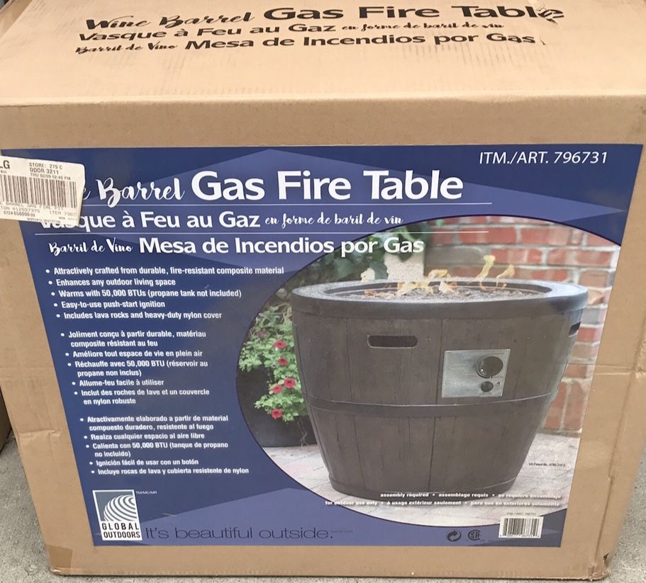 NEW IN THE BOX WINE BARREL GAS FIRE TABLE. IT PUTS OUT 50,000 BTU OF HEAT AND WORKS GREAT ON DECKS TO TAKE THE CHILL OFF.
