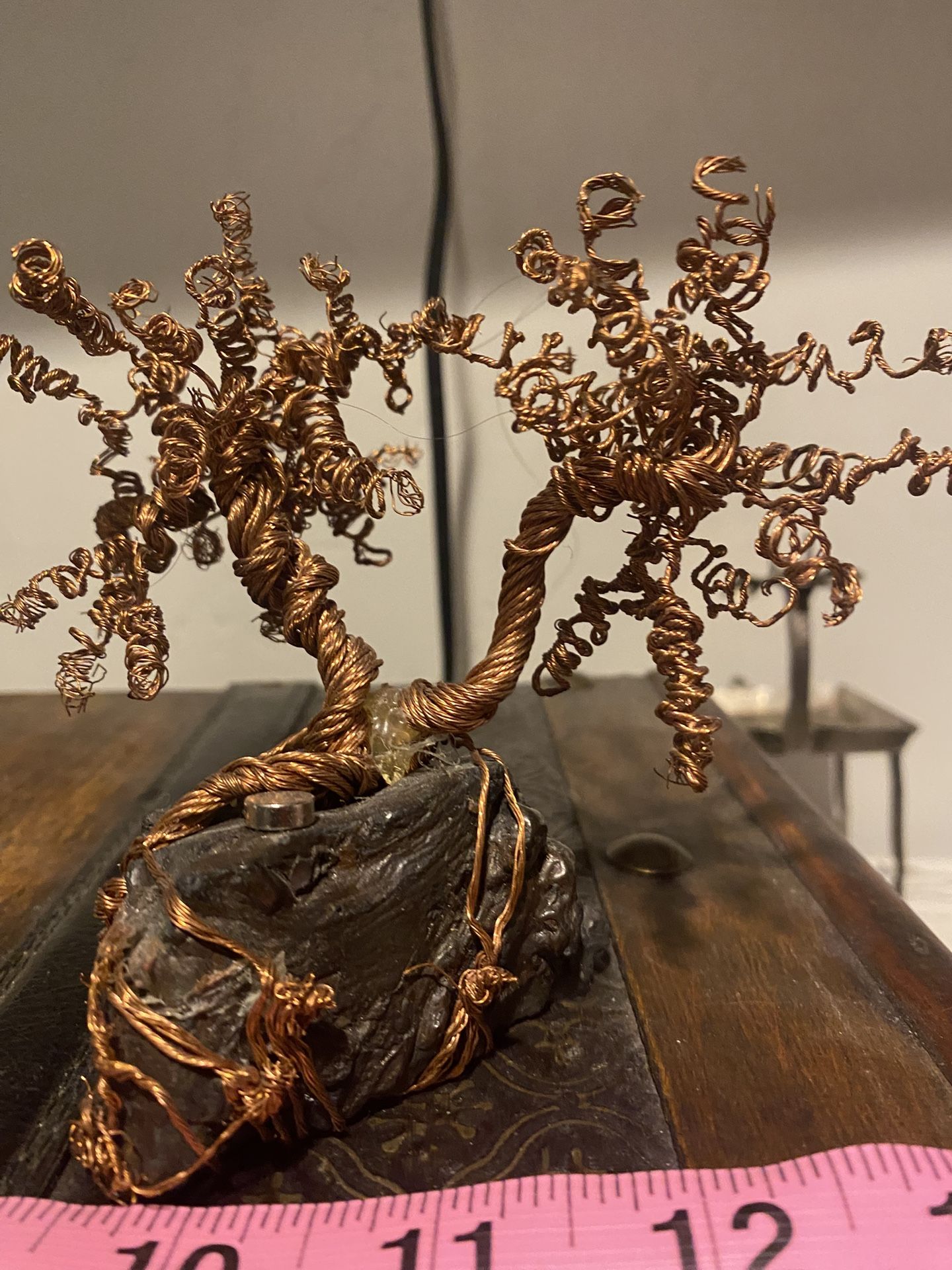 Copper wire tree on a meteorite