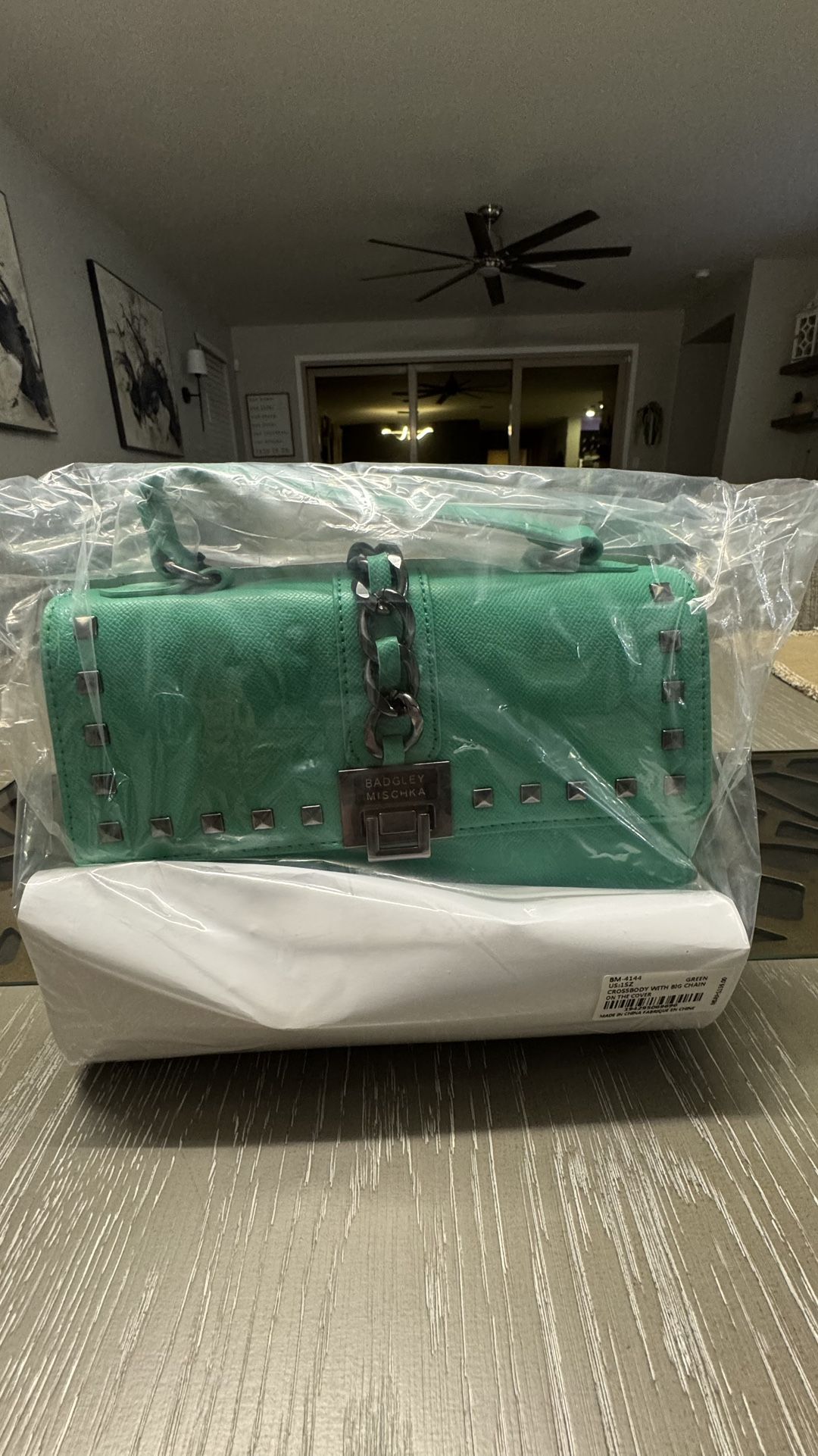 Brand new Bagdley Mischka Green crossbody with the big chain on cover