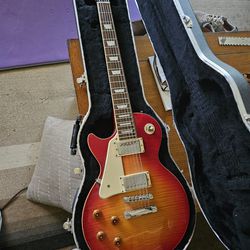 Two Lefty Guitars! Epiphone Les Paul And An Acoustic 12 String. Both Have Hard Shell Cases!