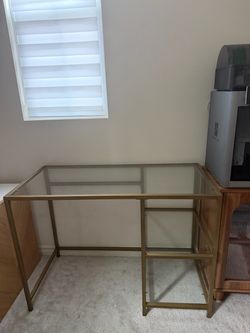 Gold glass desk and blue chair