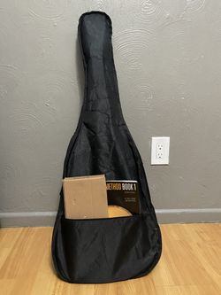 classical guitar with stand and book