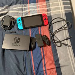 nintendo switch with mario kart and pro controller