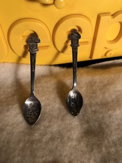 2 Small Rolex Silver teaspoons.