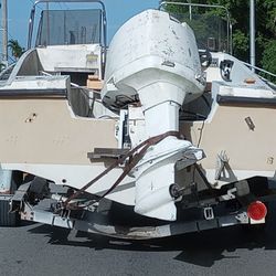 Boat With Motor And Trailer