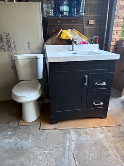 Bathroom vanity (dark brown) & toilet. $150  Pick up.