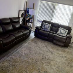 Leather Couches, Rugs, And Pillows