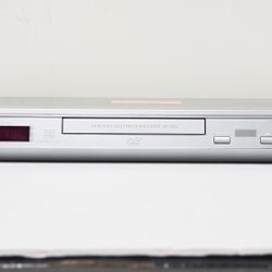 Panasonic DVD-S27 DVD CD Player in Silver with cables.