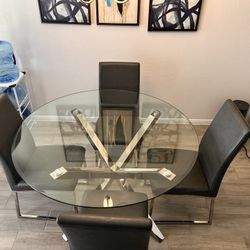 Round glass table with 4 chairs