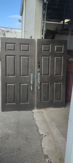 Exterior fiberglass six panel double doors with key 🗝️ to hardware hurricane impact stickers have been removed 36x36x79