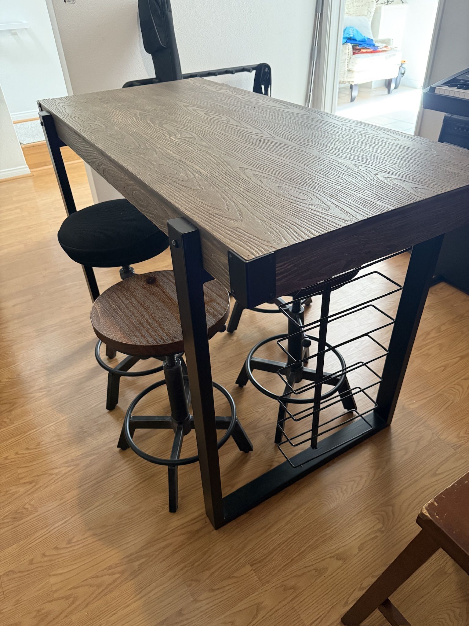 Bar table with hanging wine rack and 4 matching stools