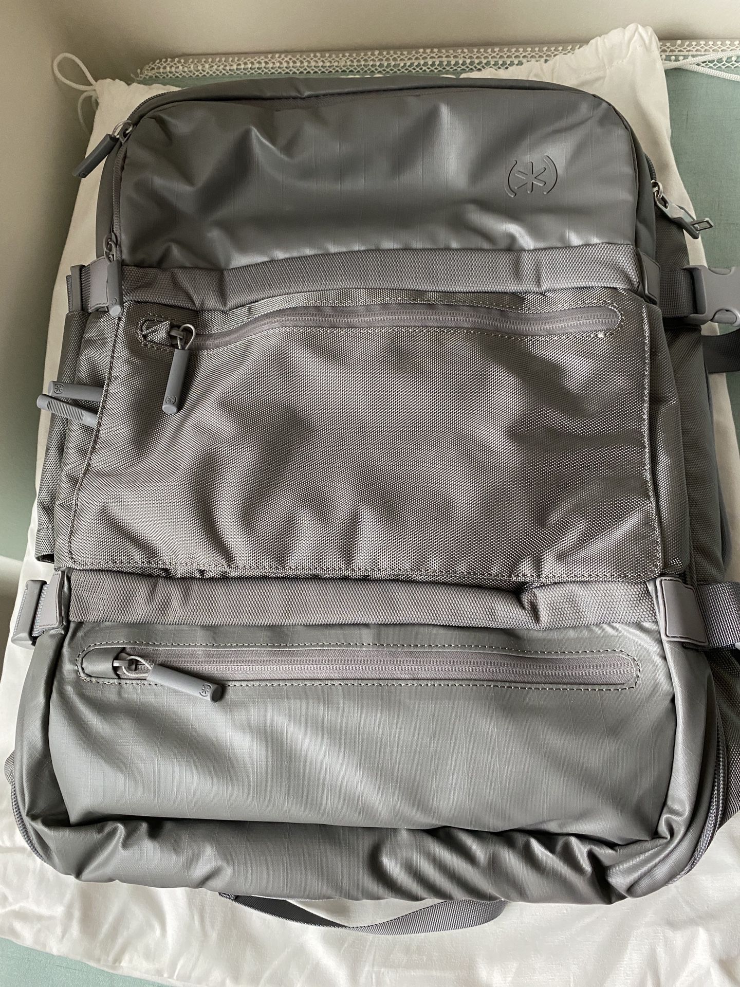 Brand new TRAVEL BACKPACK BY SPECK COLOR: CONCRETE GREY
