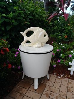 Cool unique outdoor round table. White.top spins