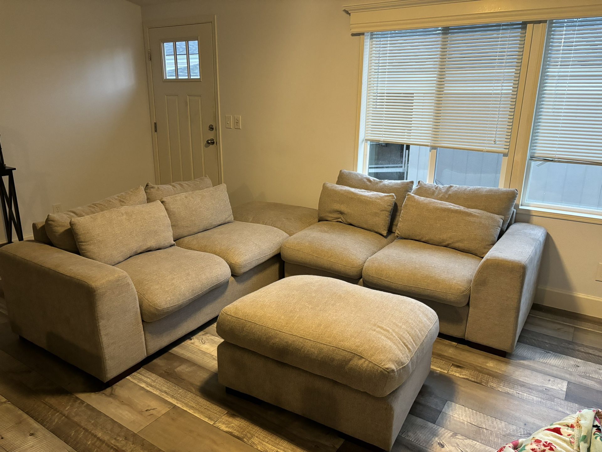 Grey Couch with two ottoman’s 
