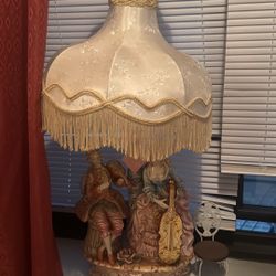 Vintage Porcelain Couple Lamp with Fringe Shade