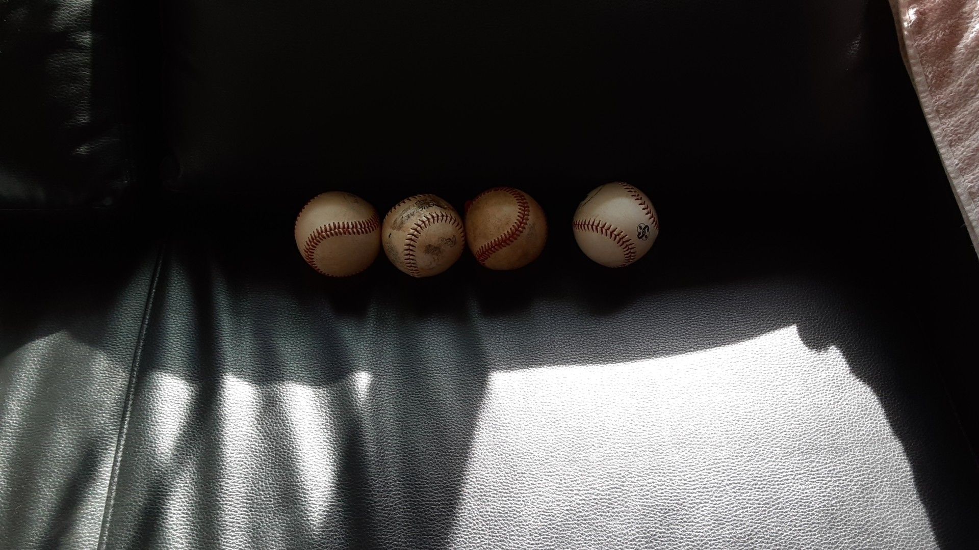 4 baseball balls