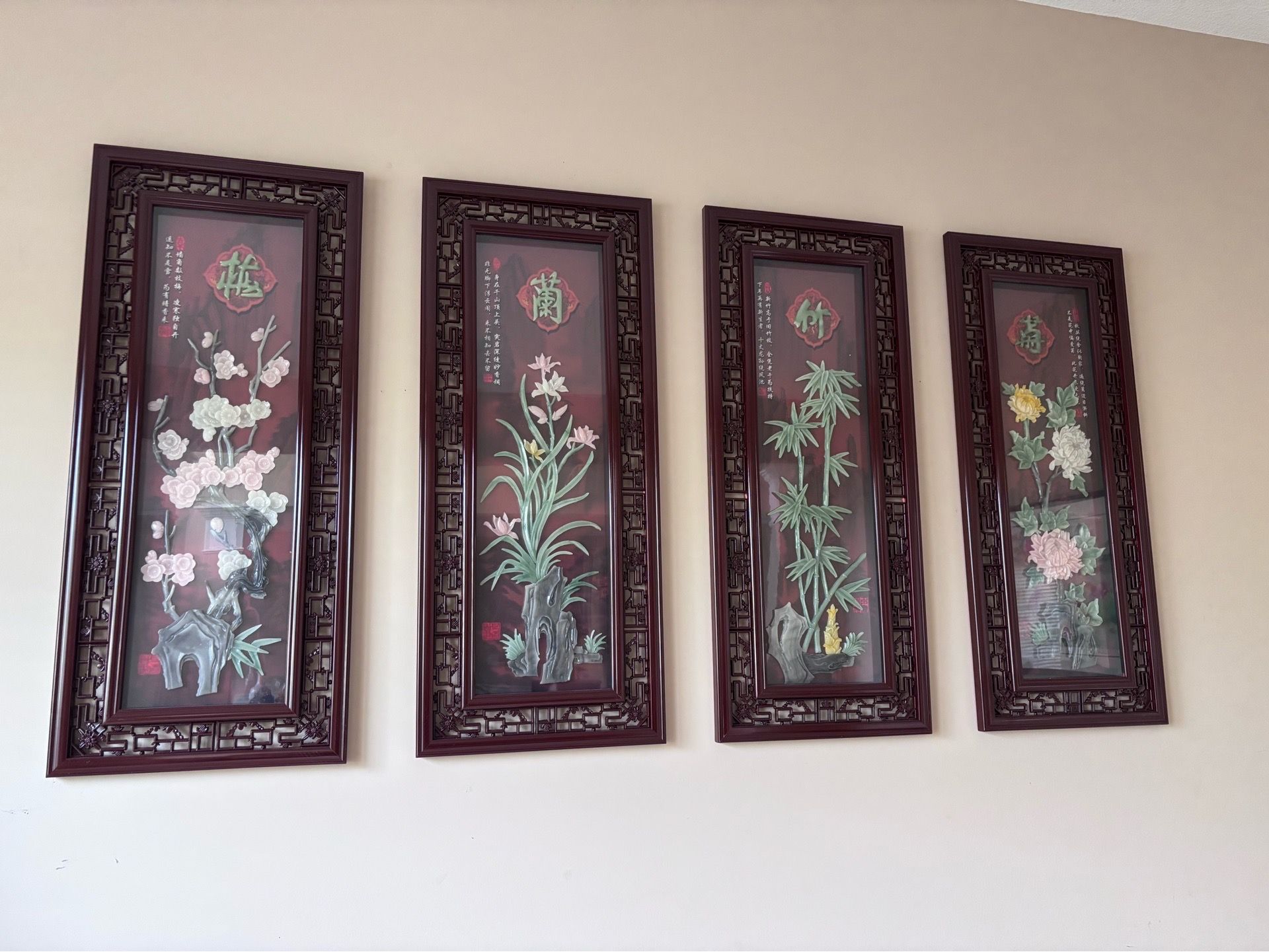 Chinese-style jade wall art featuring Plum Blossom, Orchid, Bamboo, and Chrysanthemum.