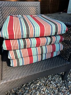 Set of 4 Hampton Bay chair cushions.