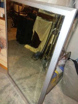 Mirror with metal frame